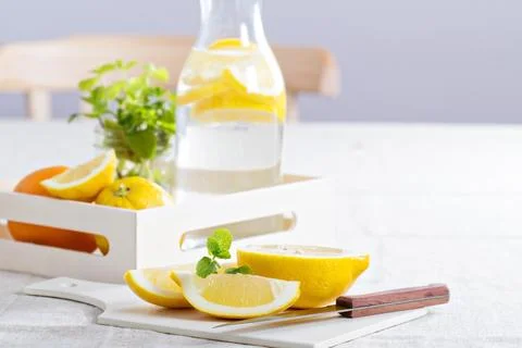 Cut lemons on a cutting board and lemonade Stock Photos