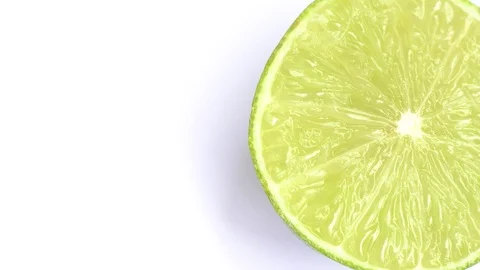 The cut lime slice rotating on a white background. Stock Footage 76595220