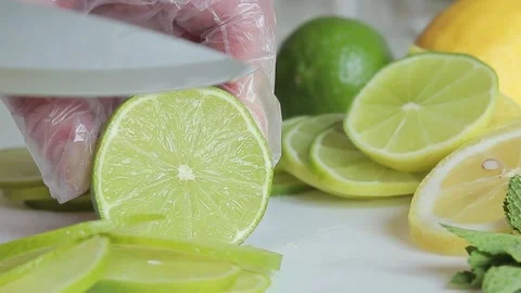 Cut the lime into slices with a knife Stock Footage 242167894
