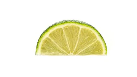 Cut lime on a white background. Macro photo. Stock Photos