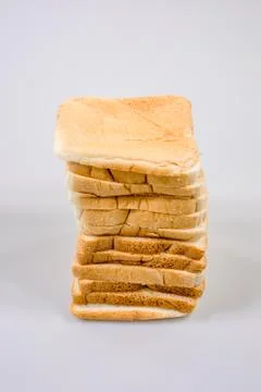 The cut loaf of bread with reflection isolated on white Stock Photos