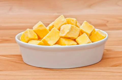 Cut of mango cut to cubes isolated Stock Photos