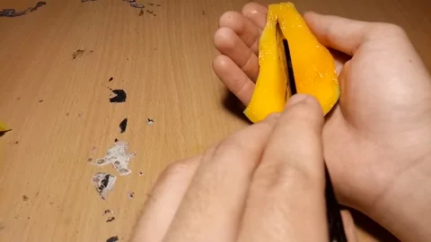 Cut a mango into square Stock Footage 256583914