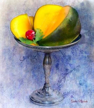 Cut mango on sterling silver dish Stock Photos