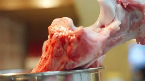 Cut from meat beef bone inside the cooking pan with water for boiling, preparing Stock Footage 318219900