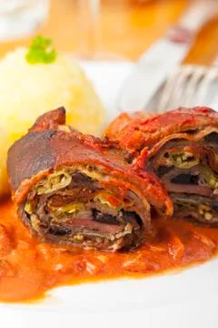 Cut meat roulade on a plate Stock Photos