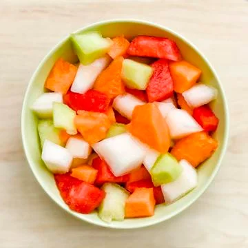 Cut melon pieces Stock Photos