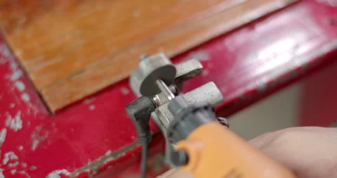 Cut the nut head with a grinder.Cut off the nut head. Stock Footage 311091109