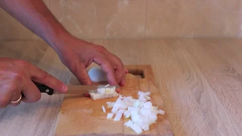 Cut the onion into cubes video Stock Footage 158549074