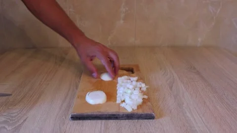Cut the onion into cubes video Stock Footage 158549076