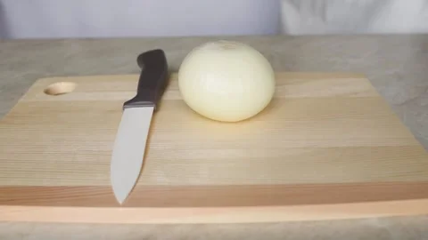 Cut onions on a wooden board Stock Footage