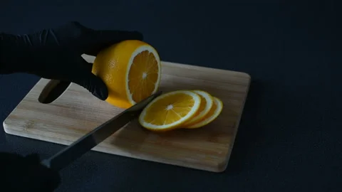 Cut orange fruit on cutting board. Stock Footage 120638887