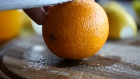 Cut orange into slices. Macro Stock Footage 70462230