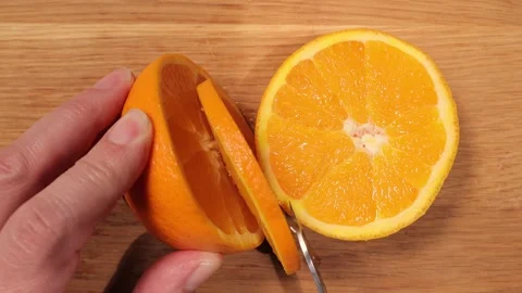 Cut an orange into slices - top down view 스톡 동영상 151059116