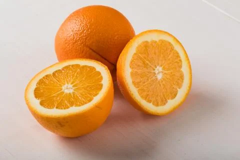 Cut oranges on table Stock Photos