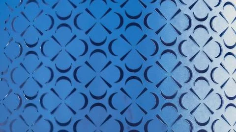 Cut out pattern with some wear in pressed metal with sun induced gradient. Foto stock