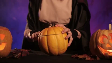 Cut out a pumpkin hat for halloween Stock Footage 163545340