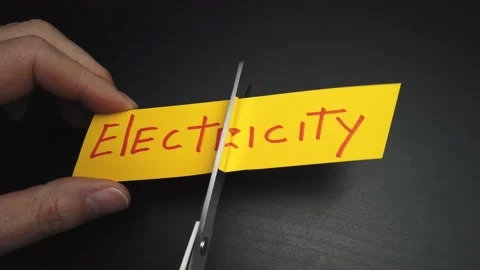 Cut out a yellow sheet of paper with the word Electricity Video stock 147491236