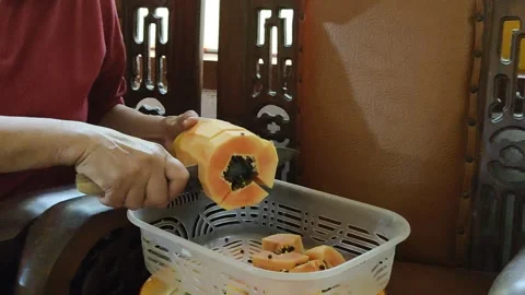 Cut the papaya using a knife Stock Footage 279384116