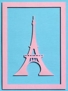 Cut from the paper Eiffel Tower on a turquoise textured background Stockfoto's
