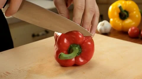 Cut paprika in half - slow motion Stock Footage 12712897