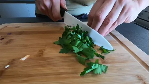 Cut the parsley on the cutting board Stock Footage 145891325