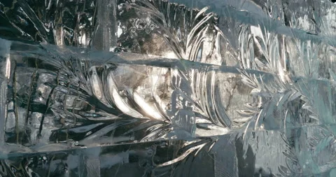 Cut patterns on the surface of a transparent ice wall Stock Footage 231580885