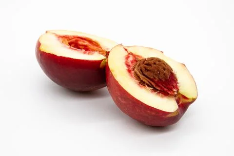 Cut peach on a white background Stock Photos