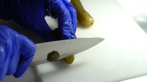 Cut the pickled cucumber into pieces Stock Footage 300483348