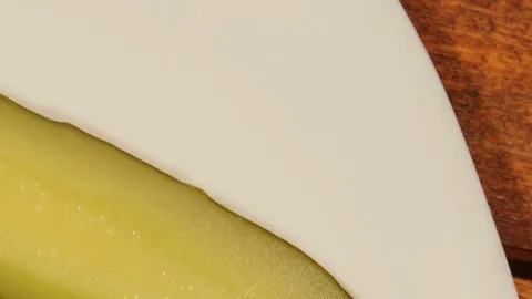 Cut pickled cucumber on white plate Stock Footage 73834937
