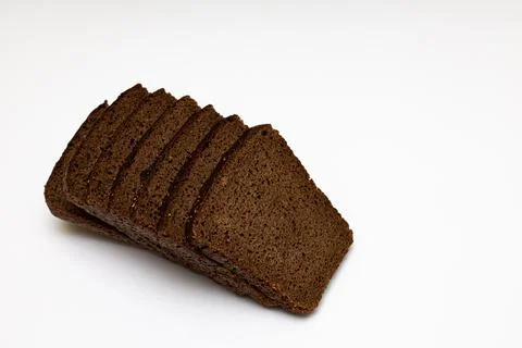 A cut piece of black bread without a knife Stock Photos
