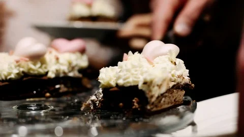 A cut piece of cake is placed on a plate Stock Footage 119367118