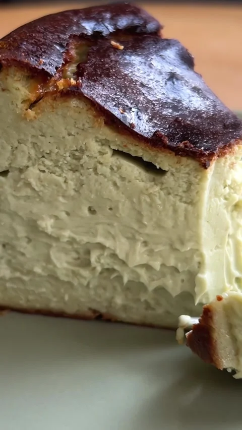 Cut off a piece with a fork Barsky pistachio cheesecake Tasty green pistachio Stock Footage 293514568