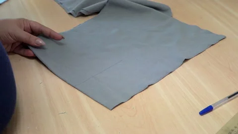 Cut off a piece of gray fabric Video stock 87755034
