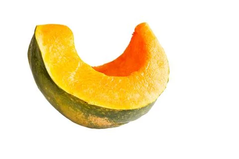 A cut piece of pumpkin on a white background is isolated. Orange pumpkin sl.. Stock Photos