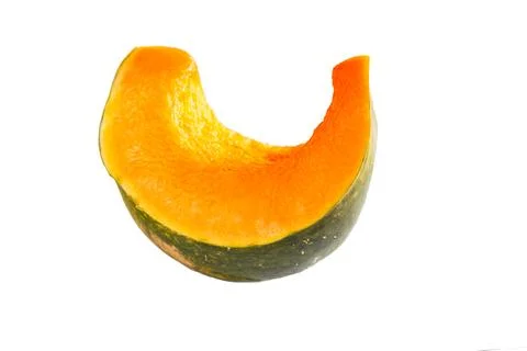 A cut piece of pumpkin on a white background is isolated. Orange pumpkin sl.. Stock Photos
