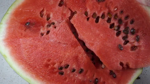 Cut a piece of watermelon in 4K Stock Footage 151644742