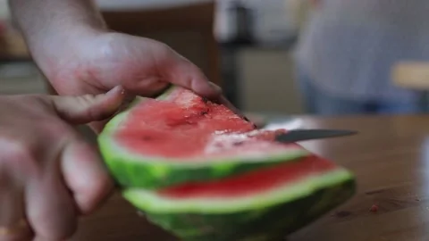 Cut off a piece of watermelon Stock Footage 130912750