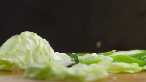 Cut pieces of mixed pepper falls down in slow motion. 스톡 동영상 69750584