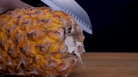 Cut pineapple fruit with knife 4k Stock Footage 149590063