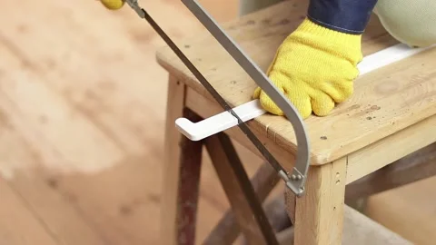 Cut a plastic part with a hacksaw Stock Footage 130620547