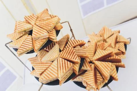 Cut platter of mixed sandwich triangles catering. 스톡 사진