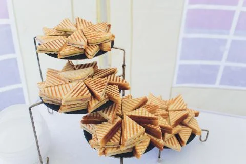 Cut platter of mixed sandwich triangles catering. 스톡 사진