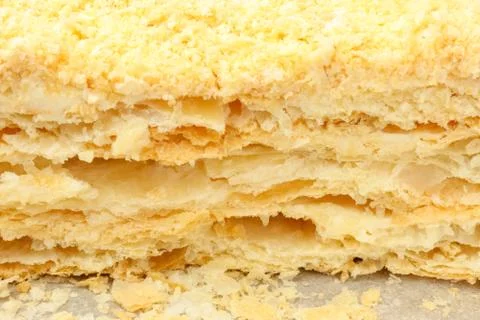 Cut of a puff cake close-up on a white background Foto stock