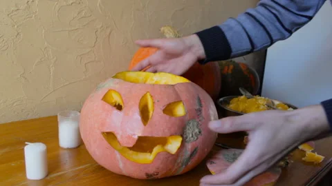 Cut pumpkin for halloween on the table Stock Footage 117338989