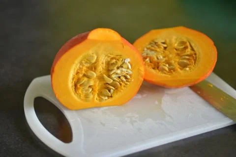 Cut pumpkin with seeds Stock-Fotos