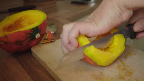 Cut the pumpkin into slices Stock Footage 95490636