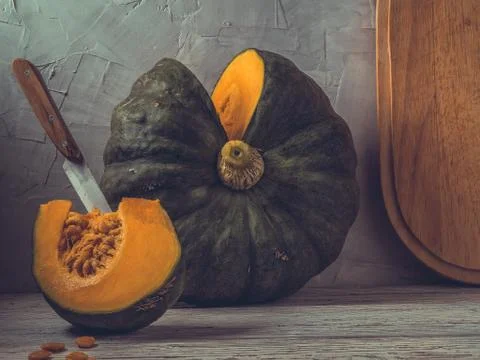Cut pumpkin on a table Stock Photos