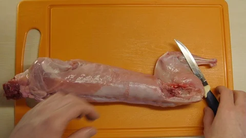 Cut the Rabbit Carcass on an Orange Board Video stock 98151293