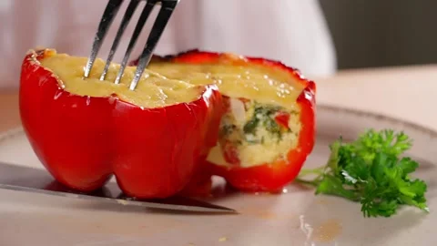 Cut ready stuffed red pepper with a mixture of eggs and vegetables, paprika Stock Footage 270151006